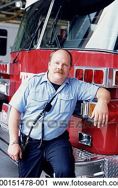 Stock Photography - firefighter leaning 
against fire engine, 
portrait. fotosearch 
- search stock 
photos, pictures, 
images, and photo 
clipart