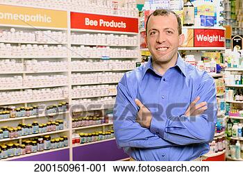 Stock Photography - man standing in 
health food store, 
arms crossed, 
portrait. fotosearch 
- search stock 
photos, pictures, 
images, and photo 
clipart