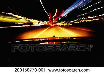 Stock Photography - car driving on 
roadway at night, 
view from inside 
car (long exposure). 
fotosearch - search 
stock photos, 
pictures, images, 
and photo clipart