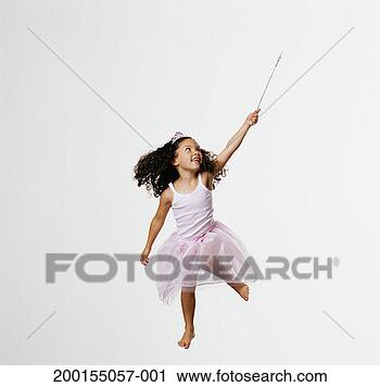 Stock Photography - girl (3-5) wearing 
fairy costume 
jumping, holding 
wand. fotosearch 
- search stock 
photos, pictures, 
images, and photo 
clipart