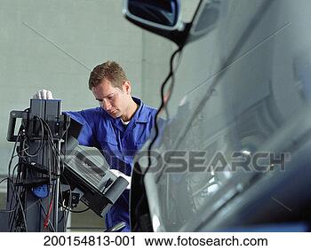 Stock Photography - mechanic carrying 
out electronic 
tuning of car 
engine. fotosearch 
- search stock 
photos, pictures, 
images, and photo 
clipart