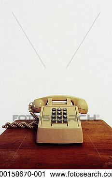 Stock Photography - telephone on desk 
(grainy). fotosearch 
- search stock 
photos, pictures, 
images, and photo 
clipart