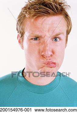 Stock Photography - young man making 
face, portrait. 
fotosearch - search 
stock photos, 
pictures, images, 
and photo clipart