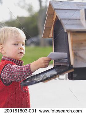 Stock Photography - baby boy (15-18 
months) putting 
letter in mailbox. 
fotosearch - search 
stock photos, 
pictures, images, 
and photo clipart