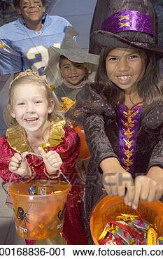 Stock Photography - children (4-8) 
in halloween costumes 
trick-or-treating. 
fotosearch - search 
stock photos, 
pictures, images, 
and photo clipart