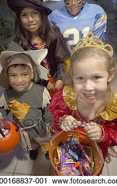 Stock Photography - children (4-8) 
in halloween costumes 
trick-or-treating, 
elevated view. 
fotosearch - search 
stock photos, 
pictures, images, 
and photo clipart