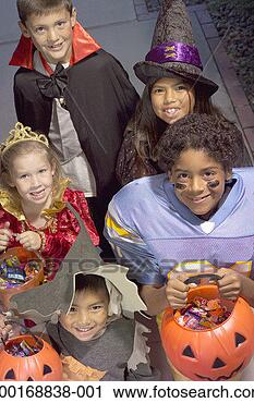 Stock Photography - children (4-8) 
in halloween costumes 
trick-or-treating, 
elevated view. 
fotosearch - search 
stock photos, 
pictures, images, 
and photo clipart
