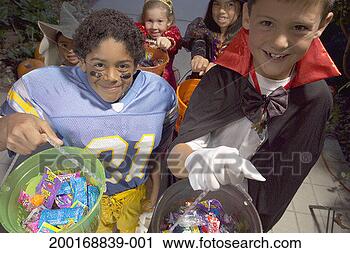 Stock Photography - children (4-8) 
in halloween costumes 
trick-or-treating, 
elevated view. 
fotosearch - search 
stock photos, 
pictures, images, 
and photo clipart