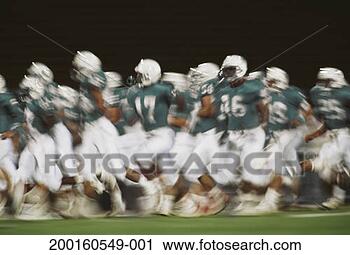 Stock Photography - football team 
running onto field 
(blurred motion, 
digital enhancement). 
fotosearch - search 
stock photos, 
pictures, images, 
and photo clipart