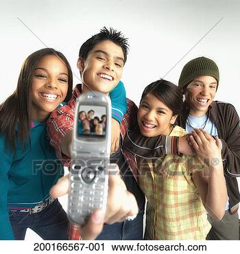 Stock Photography - four teenagers 
(13-15) photographing 
themselves with 
camera phone. 
fotosearch - search 
stock photos, 
pictures, images, 
and photo clipart