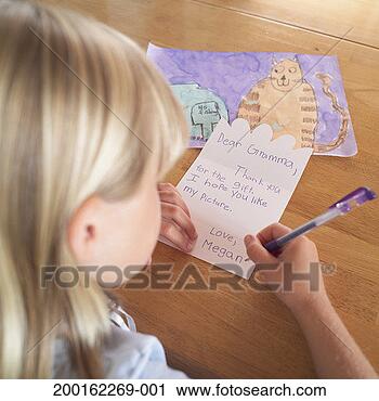 Stock Photography - girl (7-9) writing 
thank you card 
to grandmother, 
rear view. fotosearch 
- search stock 
photos, pictures, 
images, and photo 
clipart