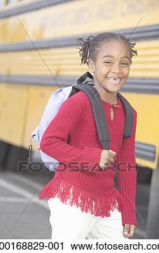 Stock Photography - girl (8-10) wearing 
backpack, standing 
in front of school 
bus. fotosearch 
- search stock 
photos, pictures, 
images, and photo 
clipart