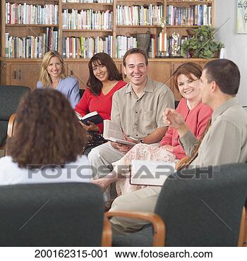 Stock Photography - group of adults 
sitting in circle, 
holding bibles, 
having discussion. 
fotosearch - search 
stock photos, 
pictures, images, 
and photo clipart