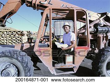 Stock Photography - heavy equipment 
operator sitting 
in cab, portrait. 
fotosearch - search 
stock photos, 
pictures, images, 
and photo clipart
