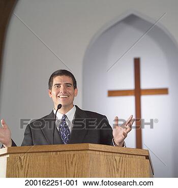 Stock Photography - male preacher 
standing at pulpit, 
gesturing, portrait. 
fotosearch - search 
stock photos, 
pictures, images, 
and photo clipart