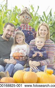 Stock Photography - mother and father 
with children 
(1-4) in pumpkin 
patch, portrait. 
fotosearch - search 
stock photos, 
pictures, images, 
and photo clipart