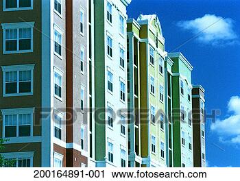 Stock Photography - row of new residential 
buildings, exterior, 
low angle view. 
fotosearch - search 
stock photos, 
pictures, images, 
and photo clipart