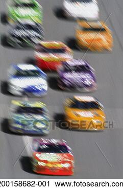 Stock Photography - stock cars on 
straight-away, 
elevated view 
(blurred motion). 
fotosearch - search 
stock photos, 
pictures, images, 
and photo clipart