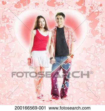 Stock Photography - teenage couple 
(14-16) holding 
hands, surrounded 
by hearts, portrait. 
fotosearch - search 
stock photos, 
pictures, images, 
and photo clipart