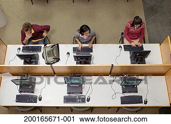 Stock Photography - three college 
students working 
in computer lab, 
overhead view. 
fotosearch - search 
stock photos, 
pictures, images, 
and photo clipart