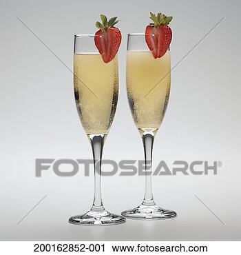 Stock Photography - two glasses of 
champagne with 
strawberry garnish. 
fotosearch - search 
stock photos, 
pictures, images, 
and photo clipart