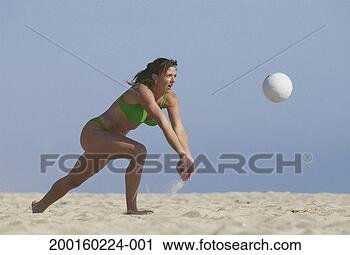 Stock Photography - woman playing 
beach volleyball. 
fotosearch - search 
stock photos, 
pictures, images, 
and photo clipart