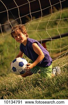 Stock Photography - 8 year old boy 
playing soccer 
in santa fe, new 
mexico. fotosearch 
- search stock 
photos, pictures, 
images, and photo 
clipart