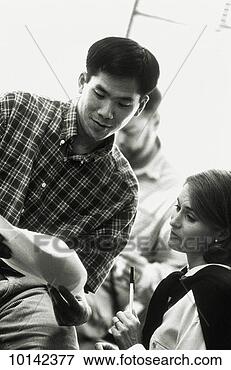 Picture - asian businessman 
and woman talk 
in office, casual 
dress. fotosearch 
- search stock 
photos, pictures, 
images, and photo 
clipart