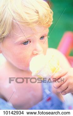 Stock Photo - blonde boy eating 
ice cream cone. 
fotosearch - search 
stock photos, 
pictures, images, 
and photo clipart