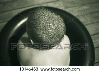 Stock Photo - boy with wet hair 
on lake dock. 
fotosearch - search 
stock photos, 
pictures, images, 
and photo clipart
