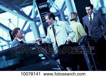Stock Photography - business travelers 
arriving at airport. 
fotosearch - search 
stock photos, 
pictures, images, 
and photo clipart