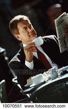 Stock Photography - businessman-working 
lunch at outdoor 
cafe. fotosearch 
- search stock 
photos, pictures, 
images, and photo 
clipart
