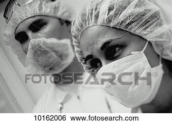 Stock Photo - clean room operations 
in bunny suits. 
fotosearch - search 
stock photos, 
pictures, images, 
and photo clipart