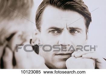 Stock Image - concerned businessman 
talking to colleague. 
fotosearch - search 
stock photos, 
pictures, images, 
and photo clipart