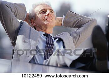 Stock Photograph - contented executive 
with feet on table. 
fotosearch - search 
stock photos, 
pictures, images, 
and photo clipart