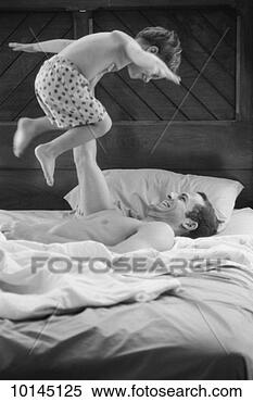 Stock Image - dad holding son 
up as he plays 
airplane. fotosearch 
- search stock 
photos, pictures, 
images, and photo 
clipart