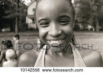 Stock Photo - girl, portrait 
after playing 
in sprinkler. 
fotosearch - search 
stock photos, 
pictures, images, 
and photo clipart