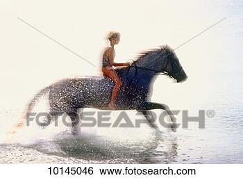 Stock Photo - girl riding horse 
on beach, us virgin 
islands. fotosearch 
- search stock 
photos, pictures, 
images, and photo 
clipart