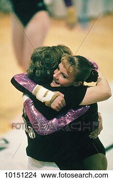 Stock Photo - gymnastics, young 
woman and coach. 
fotosearch - search 
stock photos, 
pictures, images, 
and photo clipart