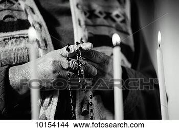 Stock Photo - hands with rosary, 
candles. fotosearch 
- search stock 
photos, pictures, 
images, and photo 
clipart
