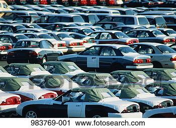 Stock Photography - import cars with 
protective covers 
parked in rows. 
fotosearch - search 
stock photos, 
pictures, images, 
and photo clipart