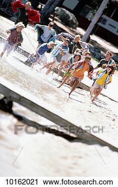 Stock Photography - kids running on 
beach at camp. 
fotosearch - search 
stock photos, 
pictures, images, 
and photo clipart