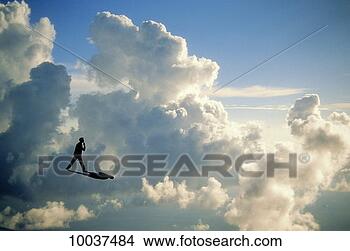 Stock Photo - man contemplating 
walking on clouds. 
fotosearch - search 
stock photos, 
pictures, images, 
and photo clipart