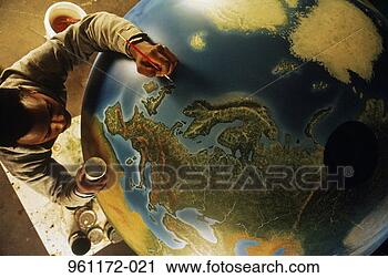 Stock Photography - man painting large 
globe, overhead 
view. fotosearch 
- search stock 
photos, pictures, 
images, and photo 
clipart