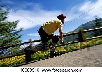 Stock Photo - man rollerblading 
in colorado. fotosearch 
- search stock 
photos, pictures, 
images, and photo 
clipart