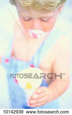 Stock Photograph - messy boy eating 
ice cream cone. 
fotosearch - search 
stock photos, 
pictures, images, 
and photo clipart
