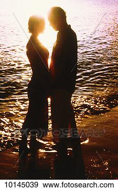 Stock Photograph - middle-aged couple 
on beach, sunset, 
st john, us virgin 
islands. fotosearch 
- search stock 
photos, pictures, 
images, and photo 
clipart