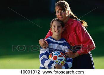 Stock Photo - mother & son with 
soccer ball in 
sante fe, new 
mexico. fotosearch 
- search stock 
photos, pictures, 
images, and photo 
clipart
