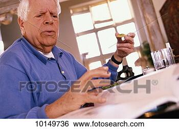 Stock Photo - seventy year old 
man eating light 
cuisine. fotosearch 
- search stock 
photos, pictures, 
images, and photo 
clipart