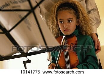 Stock Image - six year old girl 
getting violin 
lessons. fotosearch 
- search stock 
photos, pictures, 
images, and photo 
clipart